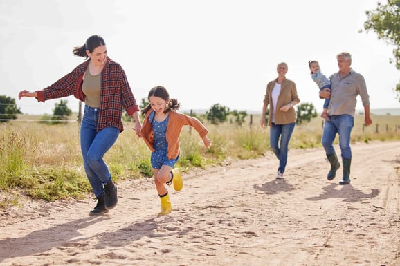 Generation of family walk together on a family homestead.