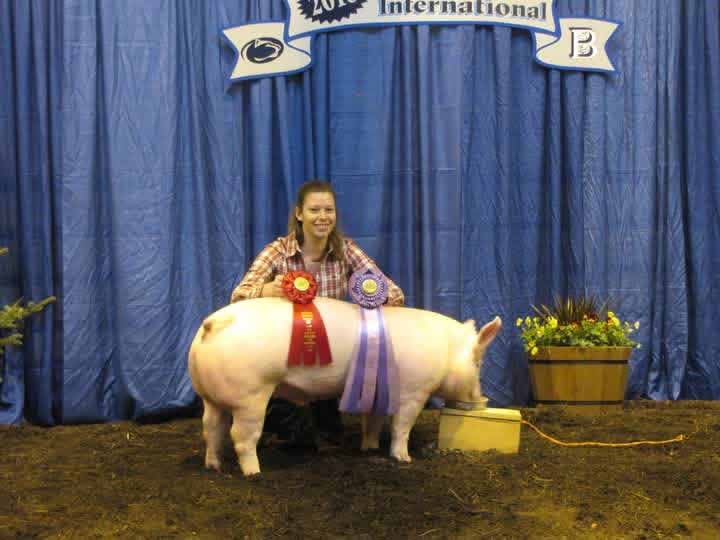 Jennifer Keister stands with her pig at the West End Fair.