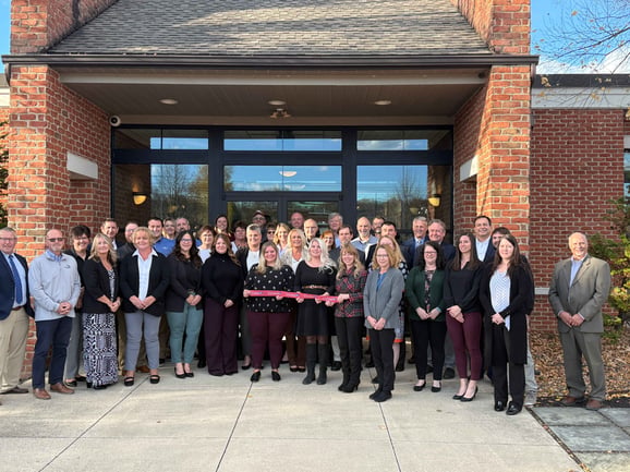 A group of employees and community members stand together for the ribbon cutting of Central Penn Bank and Trust.