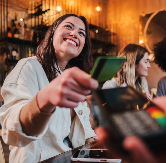 women-tapping-debit-card